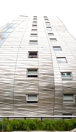 This wavy gravy metal plated building butted right up against the Highline. 